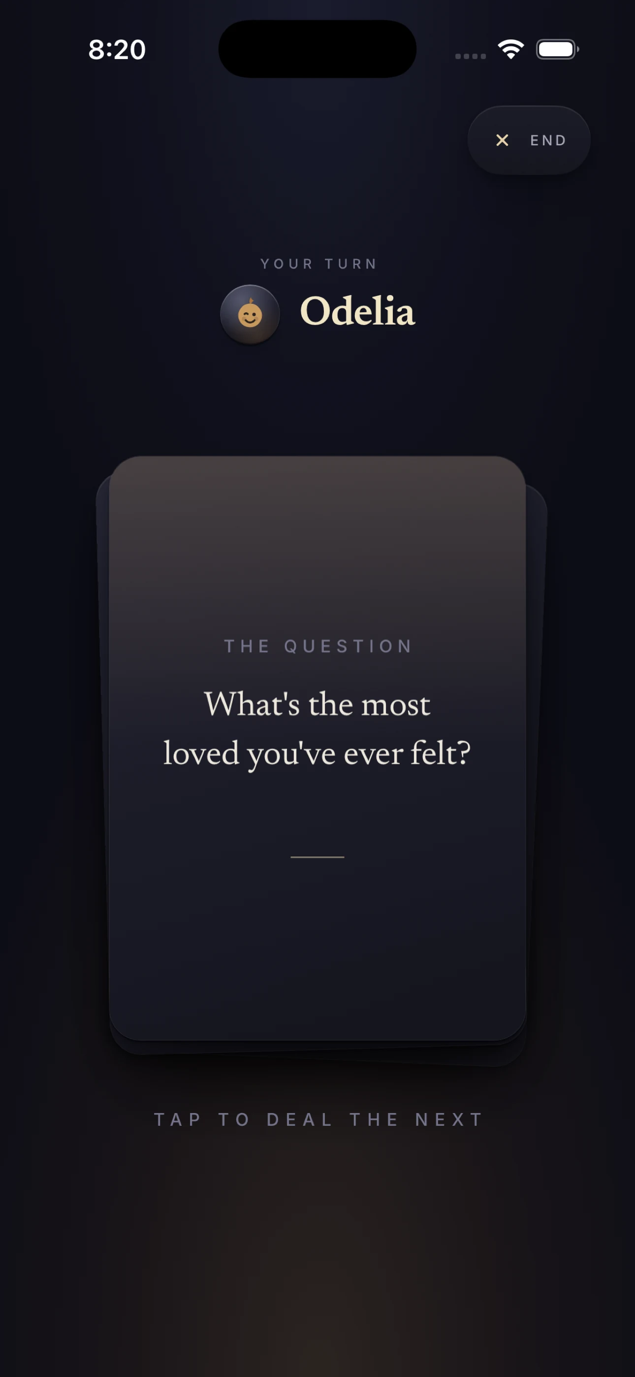 The Talking Game mid-round: a “your turn” card for the player Odelia over the question “What's the most loved you've ever felt?”, with a prompt to tap and deal the next
